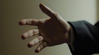 Professional businessman extending hand for handshake in formal business setting, corporate greeting gesture for partnership and collaboration concepts.