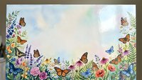 Watercolor floral border frame with colorful butterflies and wildflowers on pastel background for spring greeting cards and wedding invitations.