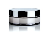 Frosted glass cosmetic jar with metallic silver lid on white background with reflection, isolated luxury skincare packaging mockup for beauty products.