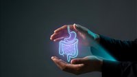Hands protecting glowing digestive system illustration representing healthcare, medical protection, gastroenterology and wellness concept.