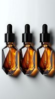 Three geometric amber glass dropper bottles with black caps arranged in row on light background, glowing with warm backlight for cosmetic product photography.