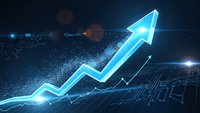 Glowing blue upward arrow chart showing business growth and success with digital particles and data visualization effects on dark background.