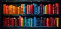 Colorful vintage hardcover books arranged on dark wooden shelves creating rainbow pattern. Collection of multicolored classic literature volumes in library setting.