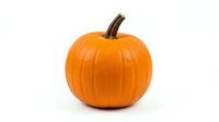 Vibrant orange pumpkin with brown stem isolated on white background, ready for autumn, fall, and seasonal design projects, thanksgiving decorations, and harvest themes.