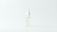Clear glass dropper bottle with white pipette cap isolated on white background for skincare and cosmetic product packaging design.