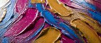Vibrant thick oil paint strokes in magenta, blue and golden yellow creating textured abstract art surface with heavy impasto technique for creative projects.