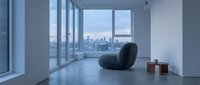 Modern minimalist interior with black sculptural chair and city skyline view through floor-to-ceiling windows, contemporary loft space for design and architecture projects.