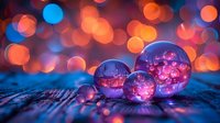 Magical glass spheres reflect pink cherry blossoms against vibrant bokeh background in blue and orange colors creating dreamy artistic composition.