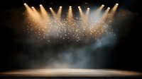 Empty wooden stage illuminated by multiple golden spotlights with dramatic smoke and glowing particles creating atmospheric theater or concert backdrop.
