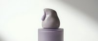 Minimalist lavender ceramic vessel with organic curved form stacked on cylindrical base, isolated on white background for design projects and product mockups.