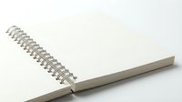 Open spiral notebook with blank pages and metal binding on white background, isolated and ready for design use on stationery, education, and office product mockups.