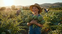 Happy senior Caucasian female farmer holding fresh cabbage harvest in organic vegetable field during golden hour sunset with mountains in background.