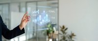 Professional businesswoman presenting holographic data analytics dashboard with financial charts and graphs in modern office environment for corporate presentations.