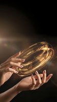 Female hands holding glowing golden energy sphere with light trails against dark background. Represents innovation, technology, and future concepts for business and design projects.
