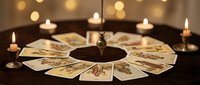 Mystical tarot card reading setup with pendulum and candles creating atmospheric fortune telling scene for spiritual guidance and divination practices.