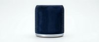 Compact smart speaker with dark blue fabric covering and silver base ring, isolated on white background for product design and tech marketing use.