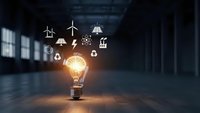 Glowing light bulb with renewable energy icons floating above in modern industrial interior showcasing sustainable power solutions and green technology innovation.
