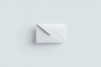 White paper envelope on light background with soft shadow, minimalist composition for business communication and correspondence design.