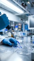 Scientist in blue gloves using pipette for laboratory research with petri dishes in modern medical facility for pharmaceutical development and testing.