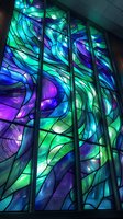 Vibrant stained glass window featuring swirling abstract patterns in turquoise, purple, and blue tones with dramatic lighting creating luminous effects through colored panels.