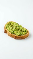 Avocado toast with mashed guacamole and black pepper on crusty sourdough bread, isolated on white background for food design use.