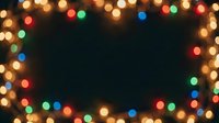 Colorful bokeh lights frame a dark center space, creating a festive border effect suitable for holiday backgrounds, seasonal promotions, and celebratory event designs.