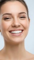 Young Caucasian woman with radiant smile showing white teeth, natural makeup and glowing skin for dental care, beauty and wellness advertising campaigns.