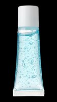 Cosmetic gel or serum bottle with light blue liquid and bubbles, white cap and ribbed base, isolated on transparent background. Ready for skincare product packaging, beauty labels, print-on-demand designs, and cosmetic marketing materials.