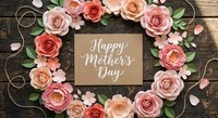 Happy Mother's Day card surrounded by coral and pink paper roses with green leaves on rustic wooden background for greeting cards and celebrations.