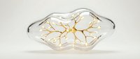 Transparent glass lips with golden branching veins inside, glowing softly on a light background, blending anatomy and luxury art design.