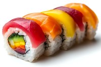 Fresh rainbow sushi rolls with tuna, salmon, and yellowtail topped with colorful fish, filled with rice, avocado and cucumber on white background.