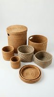 Handwoven rattan basket collection in natural tones isolated on white background for home organization and storage solutions.