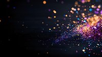 Vibrant purple and orange glitter particles scattered on dark background creating magical sparkle effect, soft focus bokeh lights floating in space.