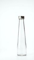 Empty glass bottle with metal cap isolated on white background for product design and packaging mockups.