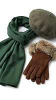 Stylish winter accessories set with green wool scarf, brown beret hat and suede gloves with fur trim isolated on white background for fashion design.