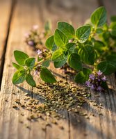 Fresh oregano herbs with purple flowers and dried spices on rustic wooden table for culinary cooking and natural seasoning in kitchen preparation.