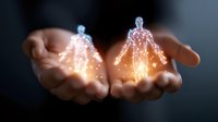 Glowing holographic human figures floating above open palms against dark background, representing digital transformation and future technology concept.