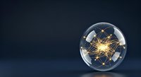 Glowing golden atom model inside transparent sphere on dark blue background, representing science, physics, technology, and molecular structure for educational and corporate use.