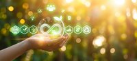 Hands holding glowing infinity symbol with eco-friendly icons representing sustainable technology, renewable energy and environmental conservation concepts.