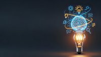 Glowing light bulb with digital brain network and innovation icons on dark background representing creativity, artificial intelligence and breakthrough ideas.
