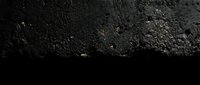 Dark asphalt road surface with rough textured pavement showing wear and aging. Black bitumen street background for urban transportation concepts.