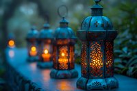 Glowing oriental lanterns with ornate metalwork create magical atmosphere in evening garden. Decorative Moroccan style lamps with warm candlelight illuminate dark background.