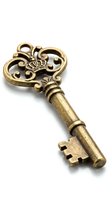 Ornate antique brass skeleton key with decorative scrollwork head and aged patina, isolated on white background for design, clipart, and vintage decor projects.