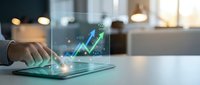 Businessman using digital tablet with holographic financial growth chart and data analytics in modern office environment for business success planning.