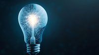 Glowing light bulb with digital network pattern inside on dark background symbolizing innovation, artificial intelligence and creative technology solutions.
