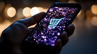 Glowing shopping cart icon on smartphone screen with purple sparkles and bokeh lights, hand holding device in dark environment for e-commerce concept.