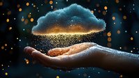 Magical glowing cloud floating above open palm with sparkling golden light particles and bokeh effect against dark background, dreamy atmosphere.