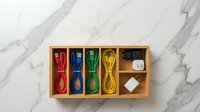 Colorful USB charging cables organized in wooden compartment box on marble surface for tech accessories storage and organization.