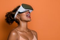 Young African American woman experiencing virtual reality headset with joyful expression on vibrant orange background for technology and entertainment concepts.
