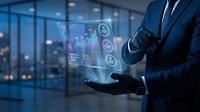 Professional businessman in dark suit presenting holographic financial data interface with charts and analytics in modern office environment at night.